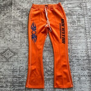 Rockstar Orange Track Pants with Blue Graphics